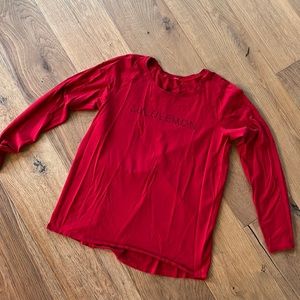Lululemon long sleeve red t-shirt with Lululemon printed on the front. Size 10!